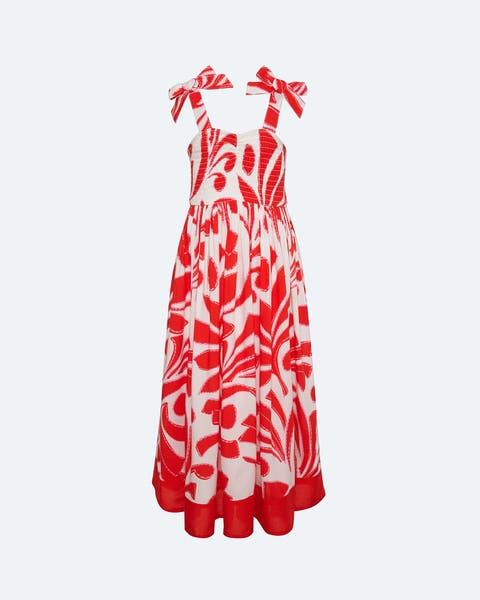A red and white sundress with tied shoulder straps.