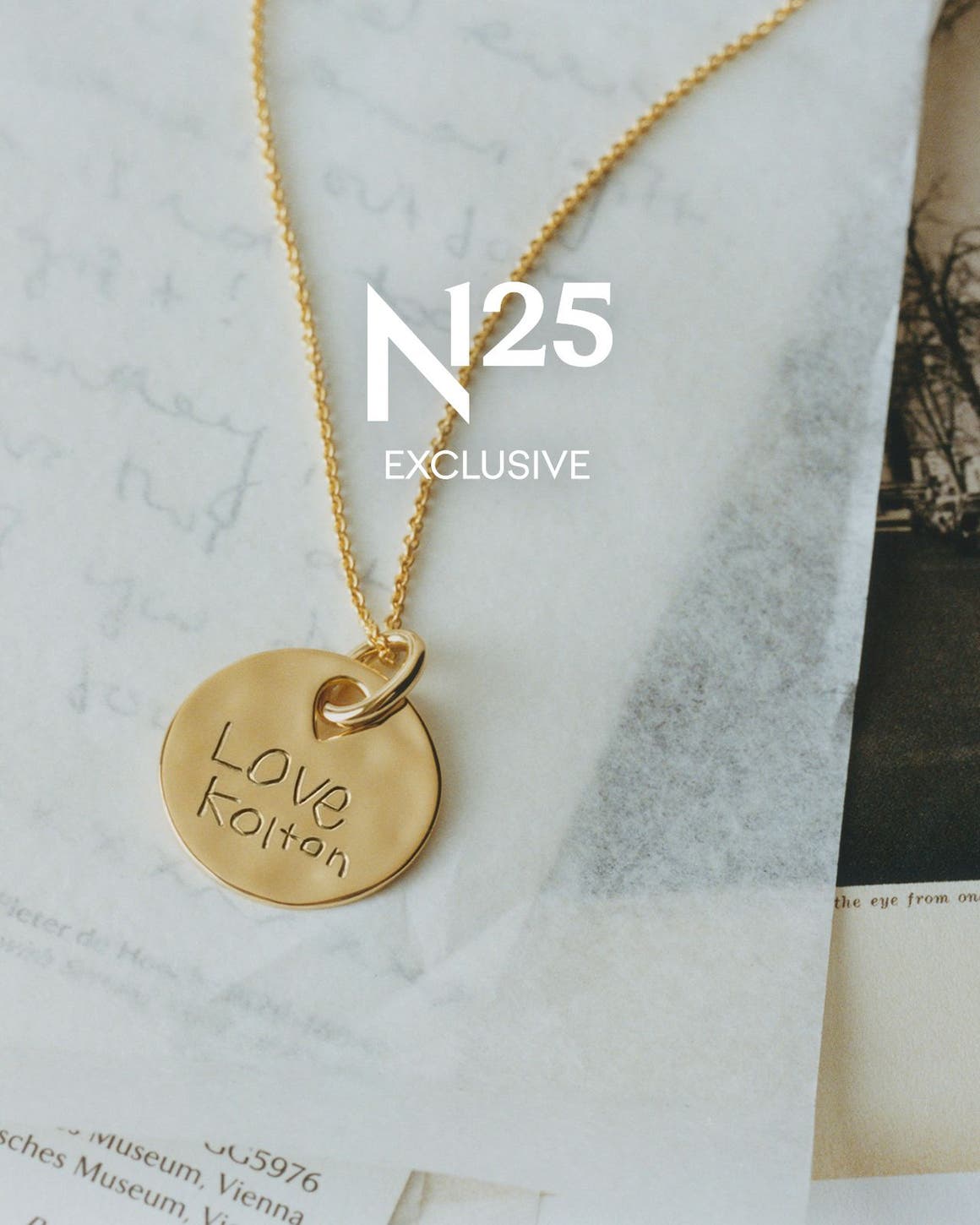 N125 exclusive; an engraved gold bracelet and pendant.