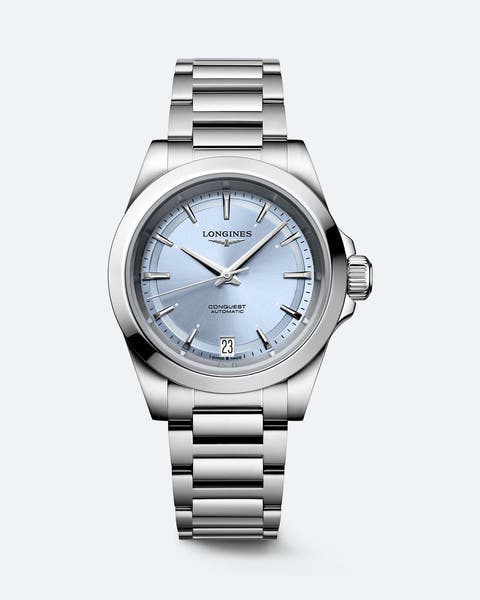 Stainless steel Longines watch with a light blue face.