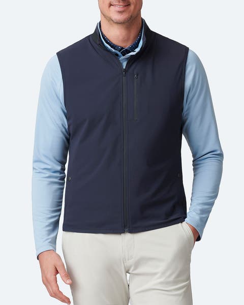 A man wearing a navy blue vest.