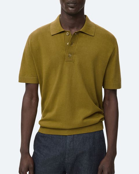 A man wearing an olive green polo.