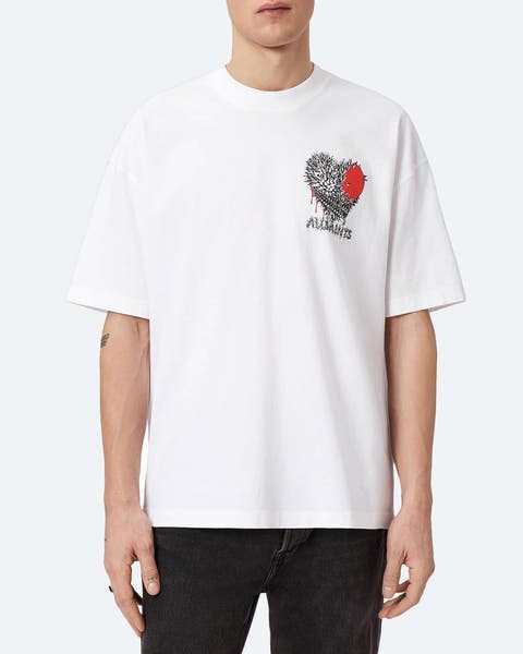 A man wearing a logo T-shirt.