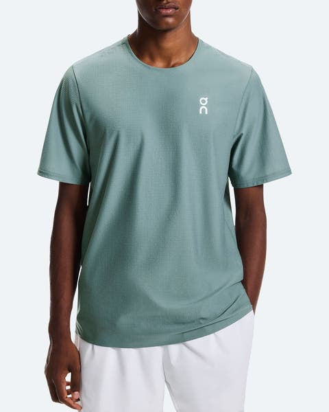 A man wearing an athletic T-shirt from On.