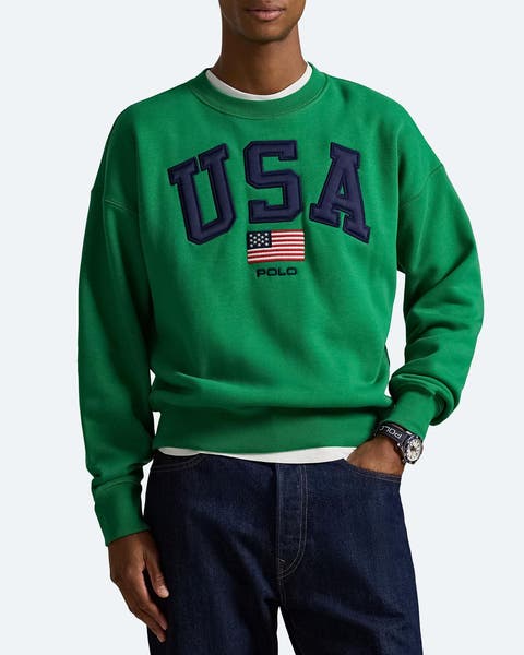 A man wearing a green USA sweatshirt.