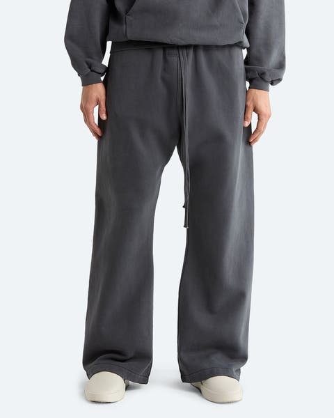 A man wearing baggy grey sweatpants.