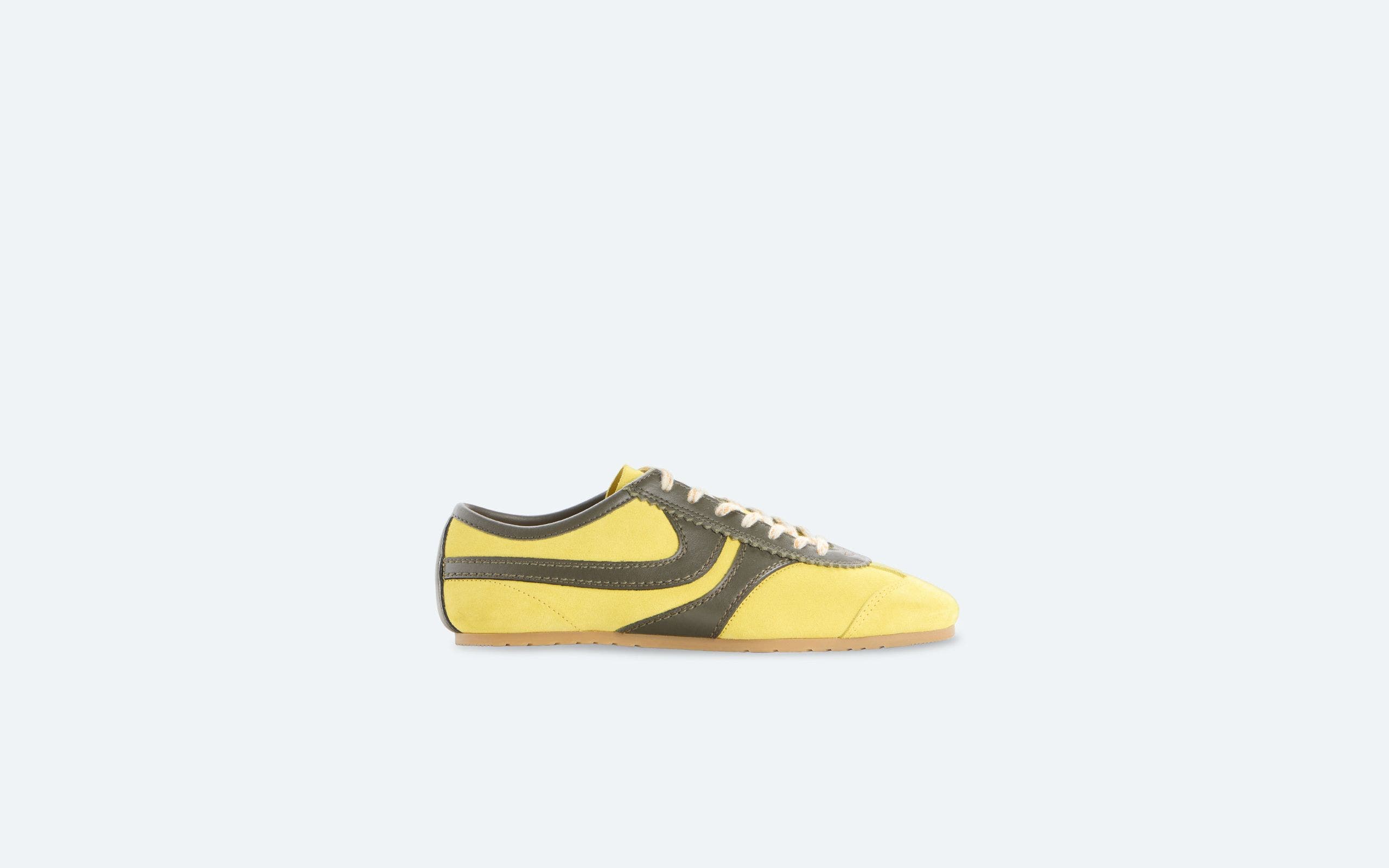 Yellow, soccer-style sneakers.