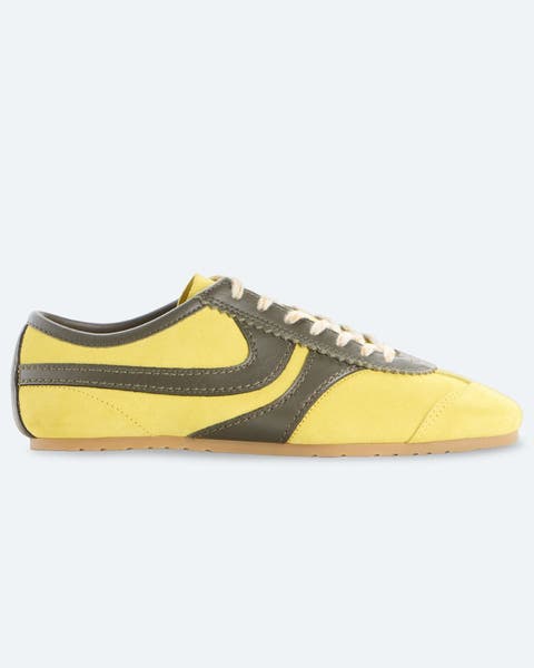 Yellow, soccer-style sneakers.