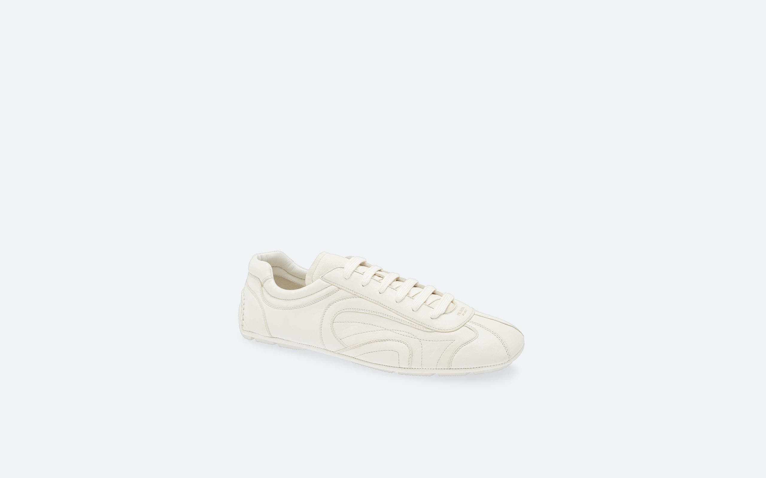 White Prada sneakers.