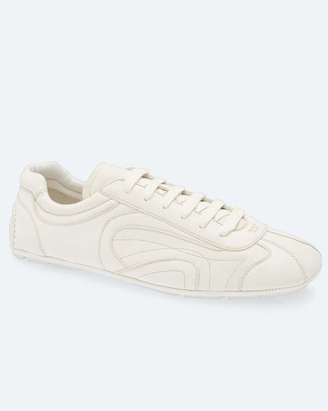 White Prada sneakers.