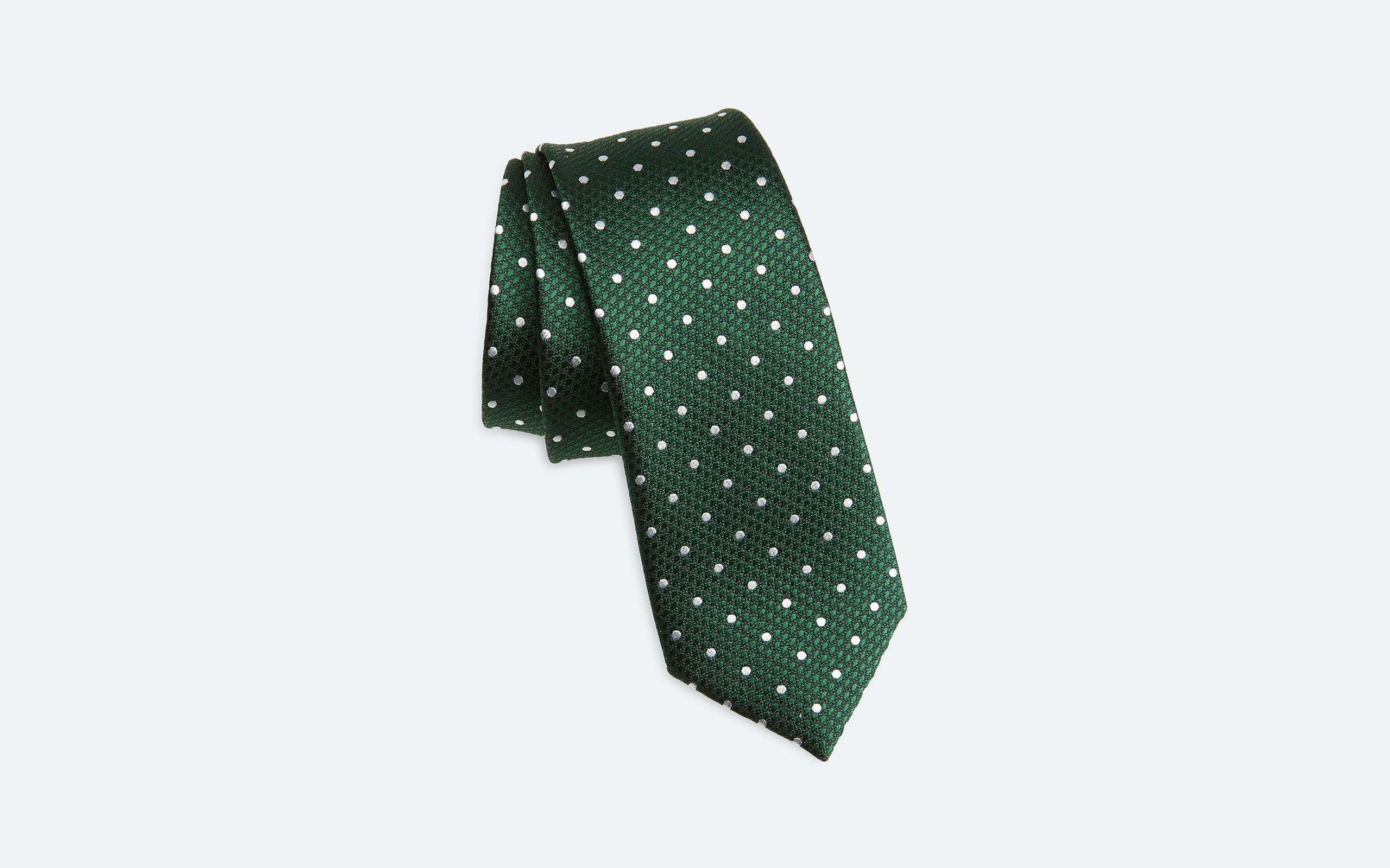 A green tie with white polka dots.