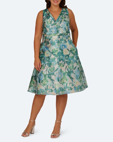 A woman wearing a floral jacquard midi dress. 