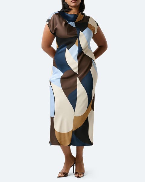 A woman wearing a geo print sheath dress.