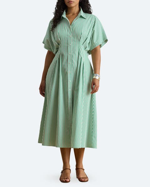 A woman wearing a striped shirtdress.