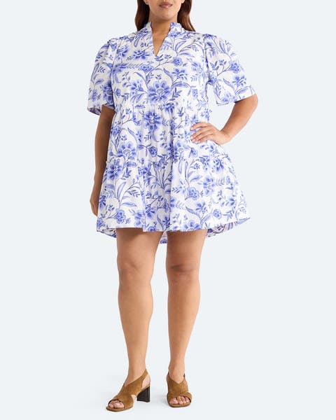 A woman wearing a floral minidress.