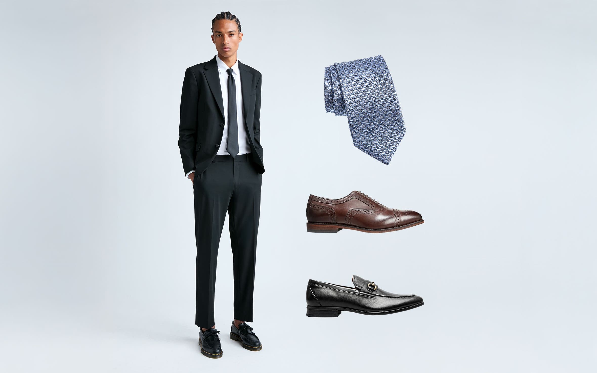A man in a suit. Dress shoes and a tie.