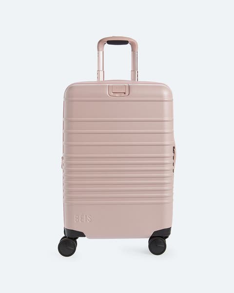Pink roller suitcase.