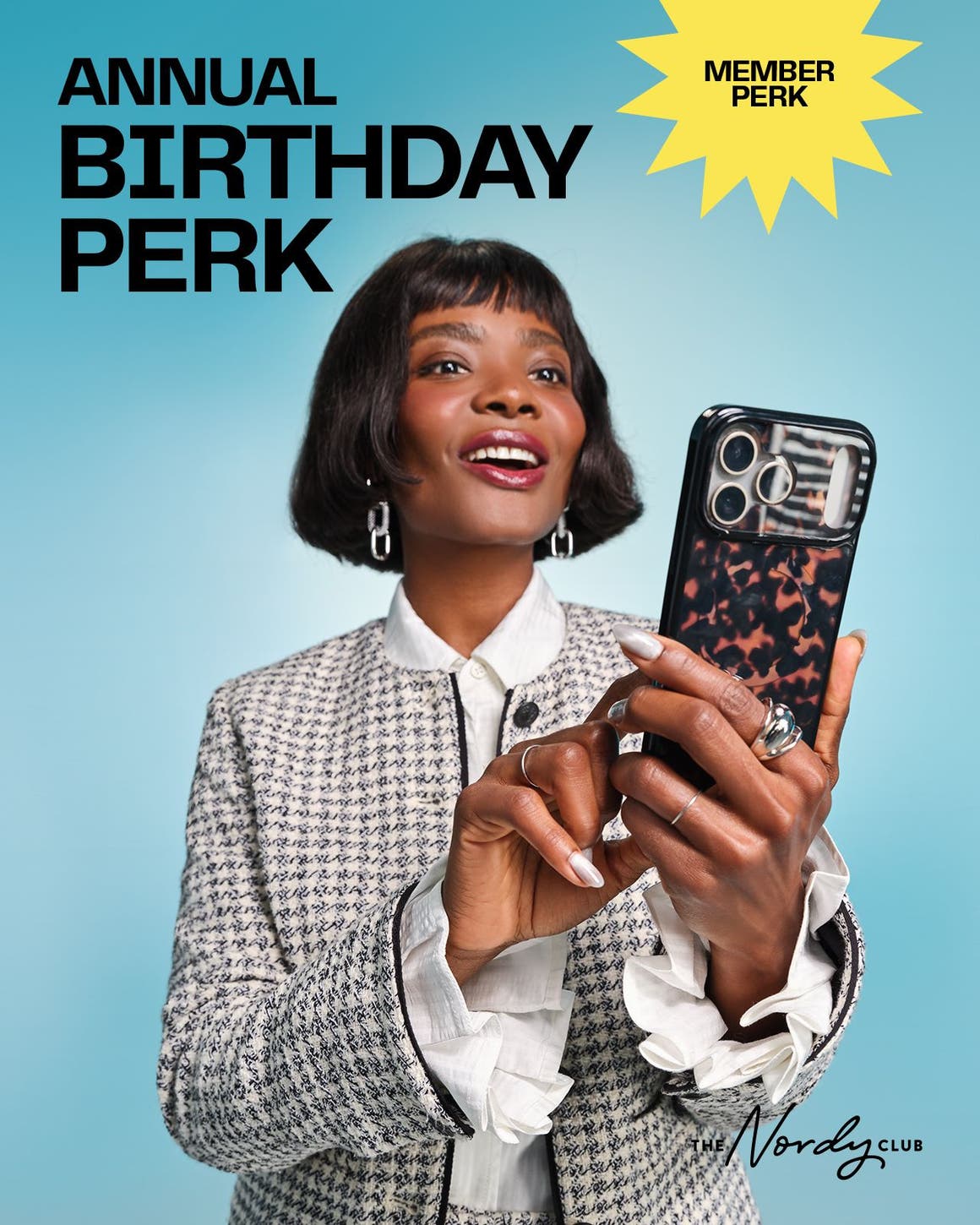 Member perk: annual birthday perk. A woman holding shopping bags.