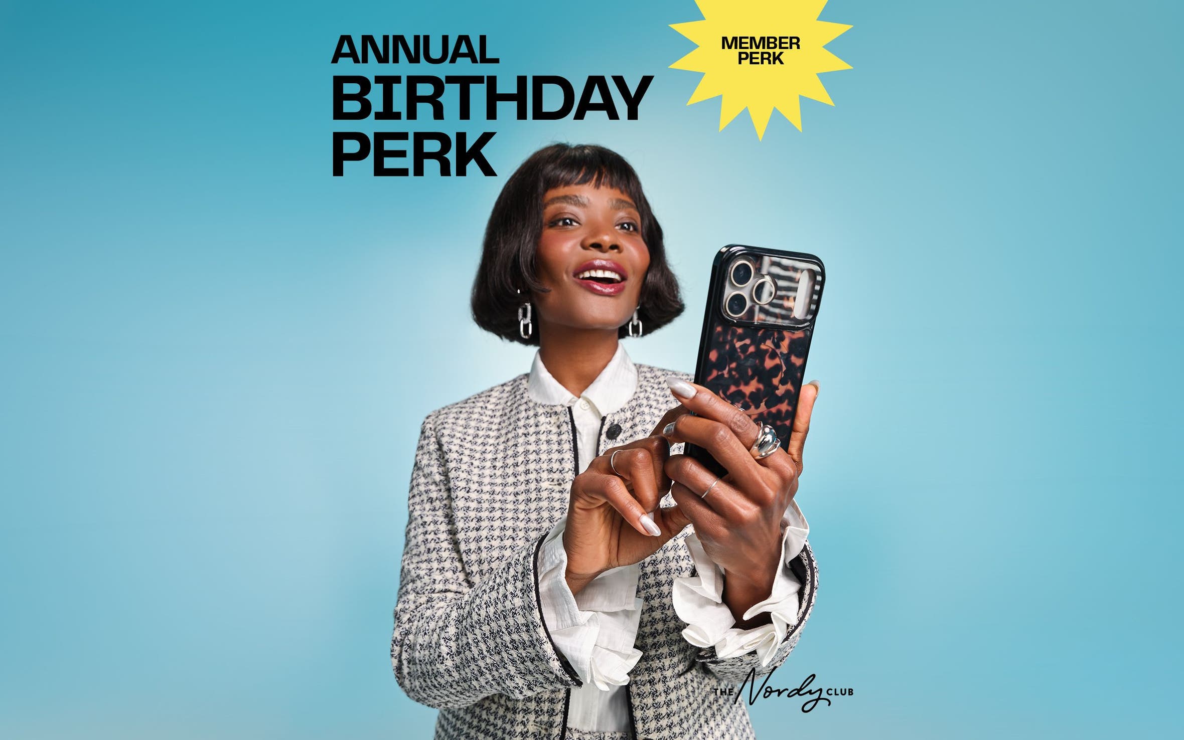 Member perk: annual birthday perk. A woman holding shopping bags.