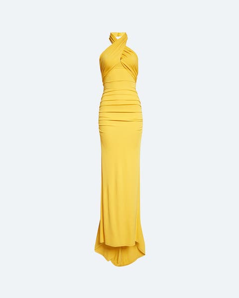 Model wearing a Carolina Herrera evening gown in yellow.