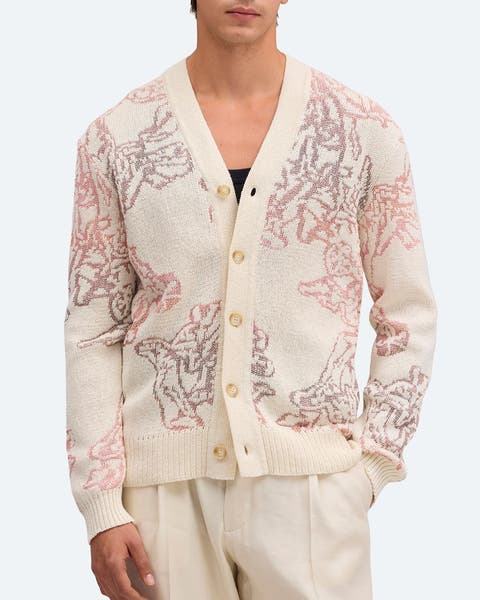 A man wearing a patterned V-neck cardigan.