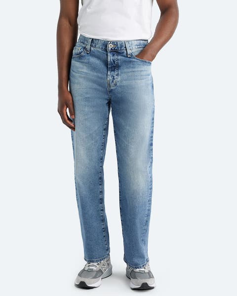 A man wearing straight-fit jeans.