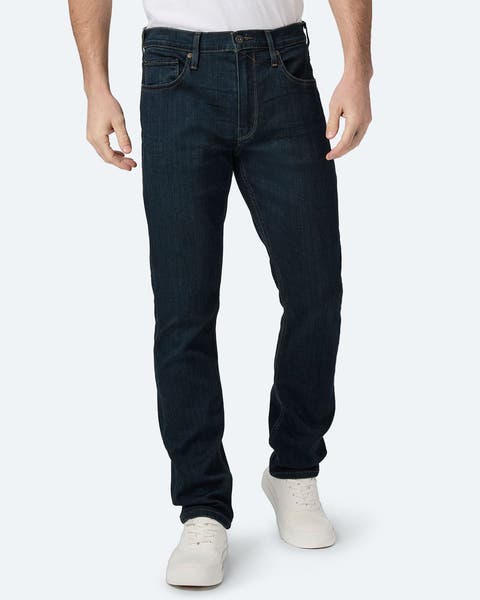 A man wearing slim straight-fit jeans.