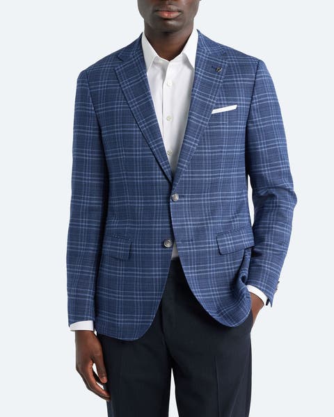 A man wearing a BOSS blazer.