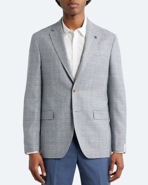 A man wearing a Jack Victor blazer.