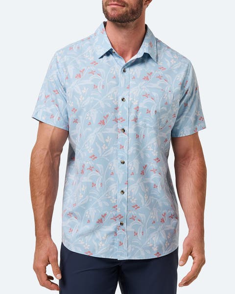 A man wearing a casual button-up shirt.