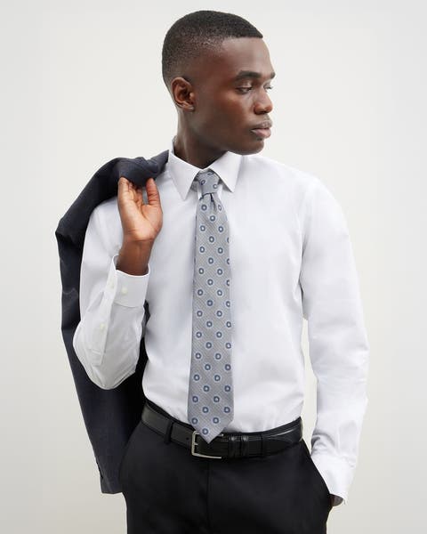 A man wearing a shirt and tie.