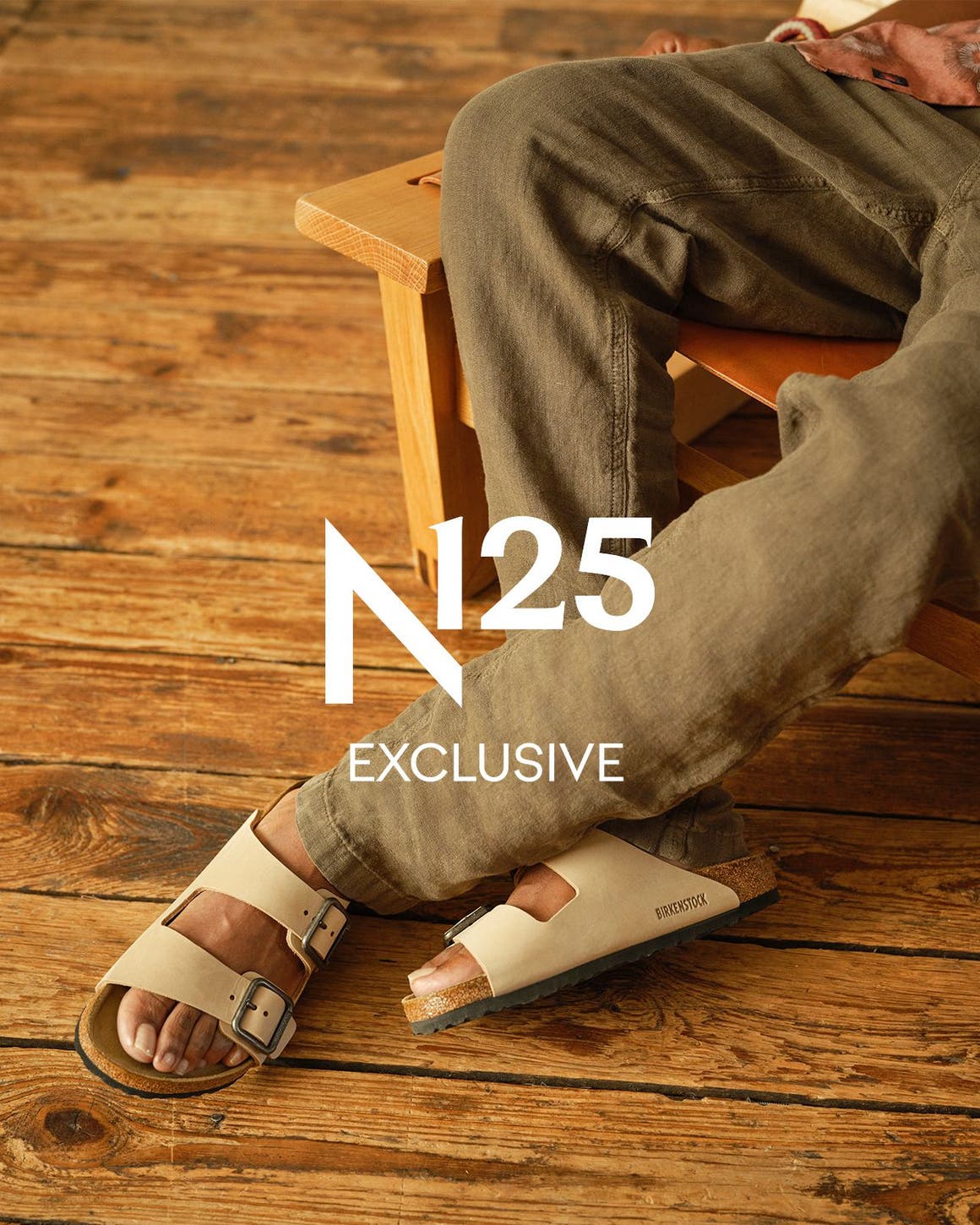 A man wearing shoes and clothes from the Birkenstock and Faherty collection.