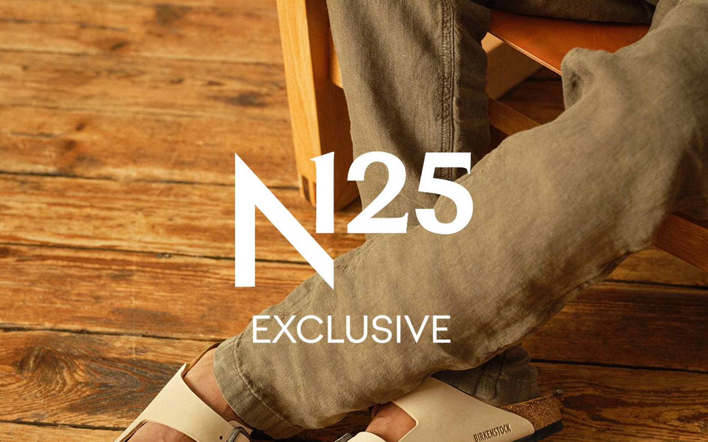 A man wearing shoes and clothes from the Birkenstock and Faherty collection.