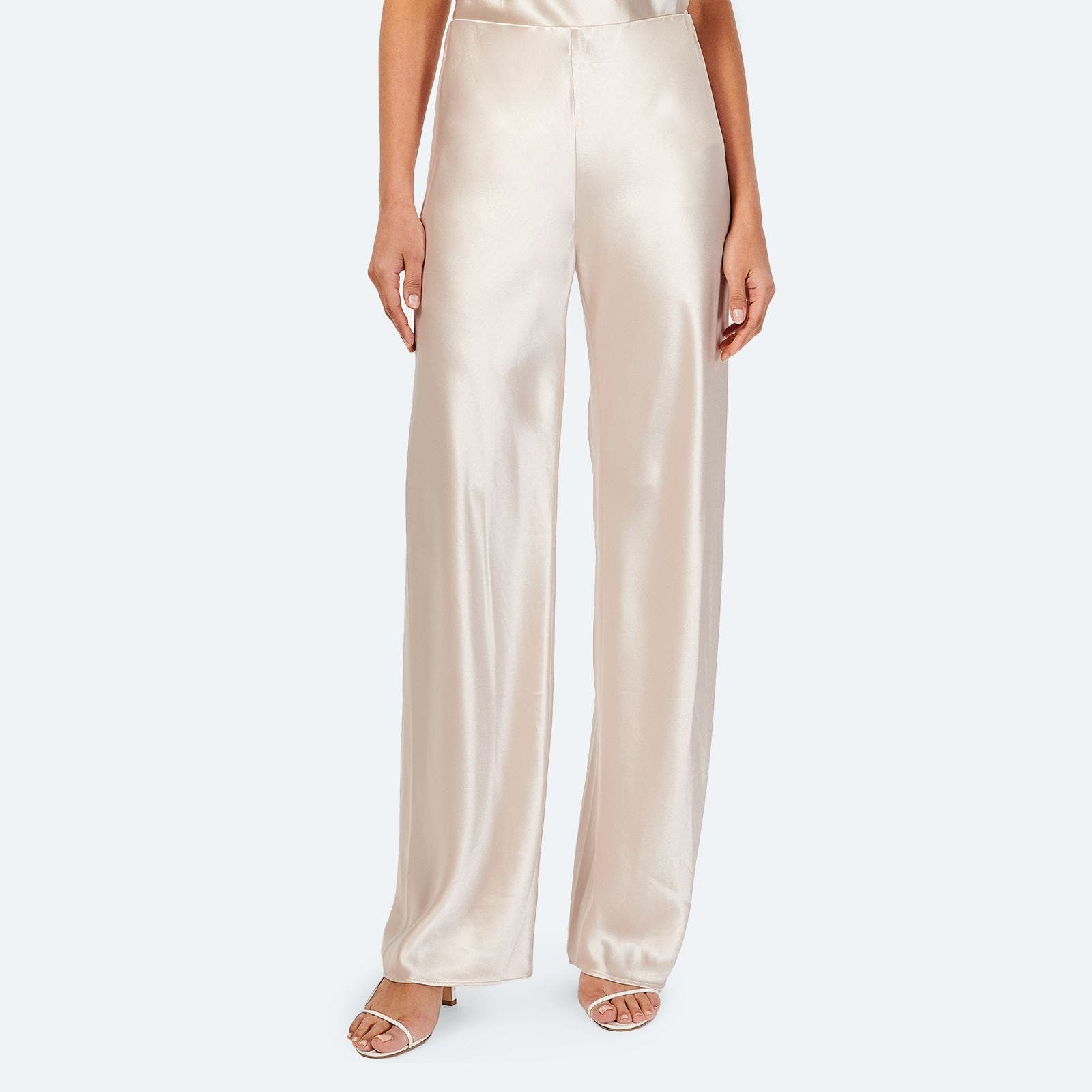 A pair of light pink satin pants.