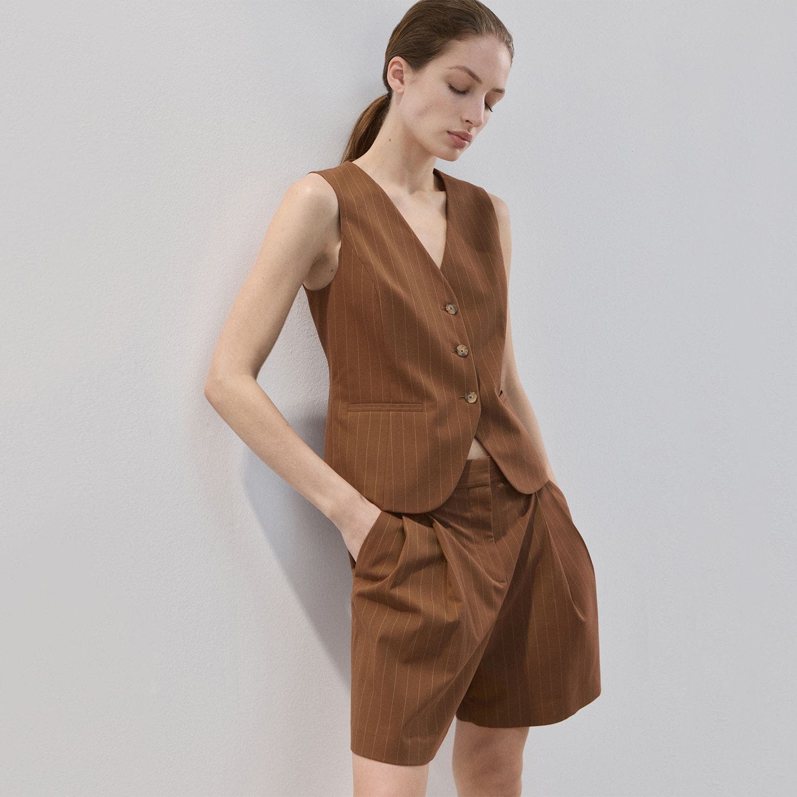 Brown pinstripe shorts.
