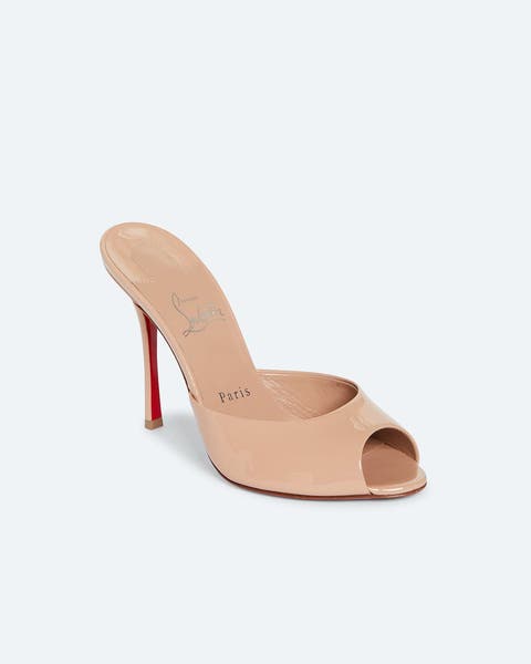 A Christian Louboutin beige high heel.