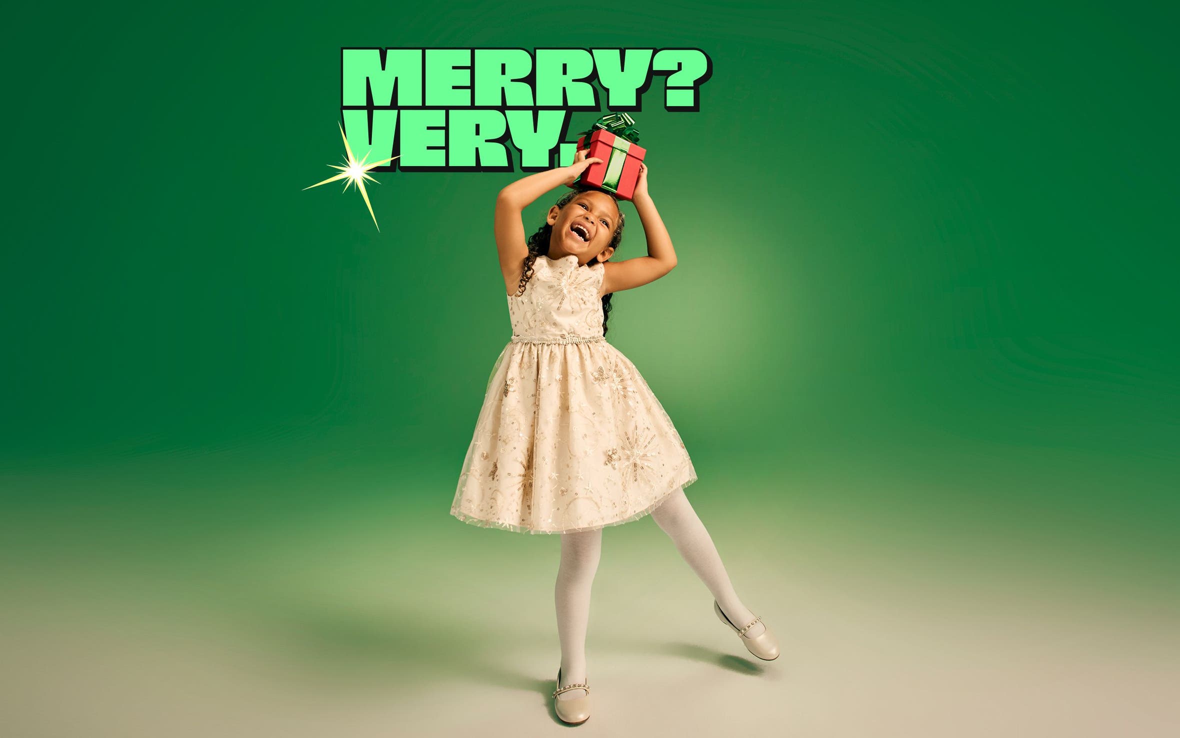 Merry? Very. A young girl poses with a gift. 