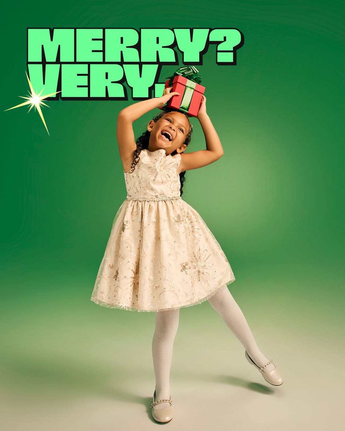 Merry? Very. A young girl poses with a gift. 