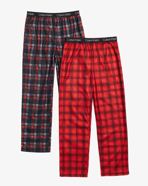 Kids' 2-pack plaid pajama pants in black/red and red/black.