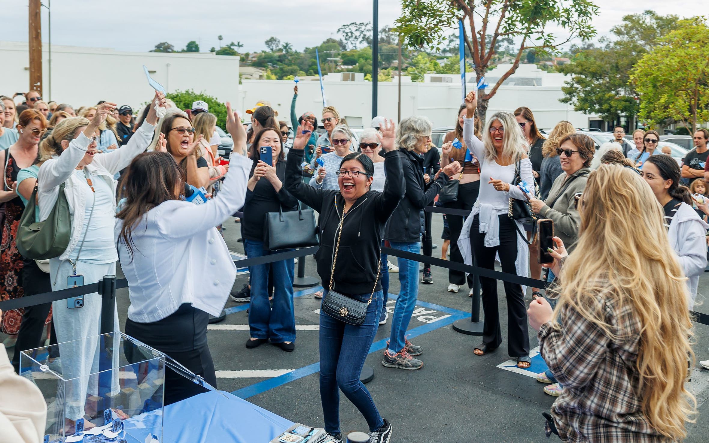 Customers at a grand opening celebration for a Nordstrom Rack store.