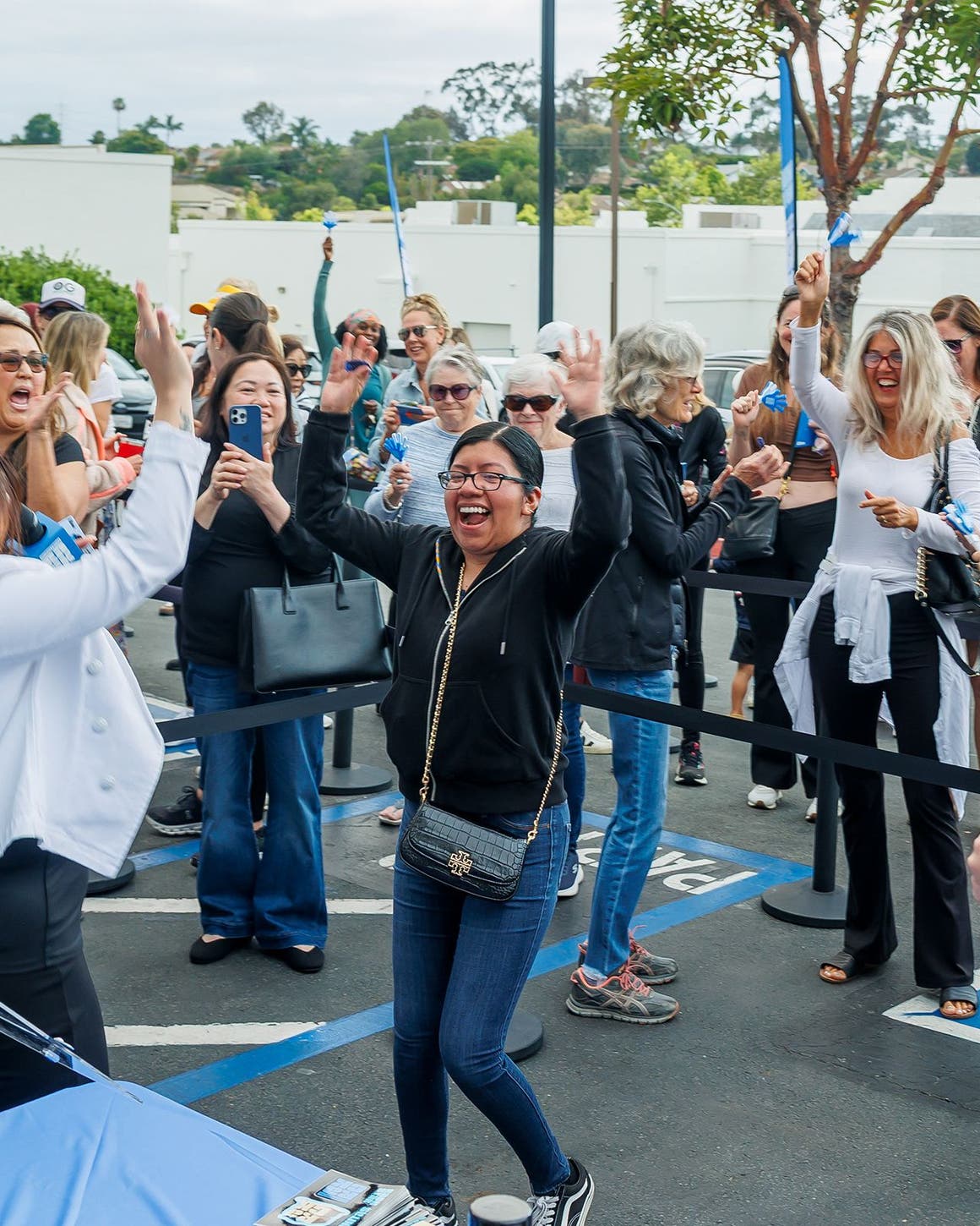 Customers at a grand opening celebration for a Nordstrom Rack store.