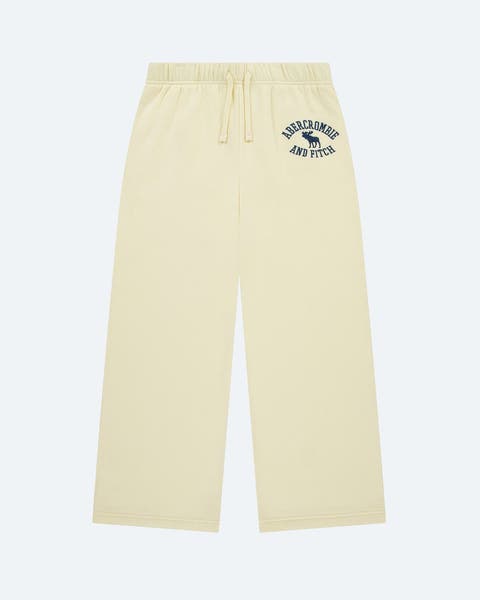 A pair of butter yellow sweatpants from abercrombie kids.