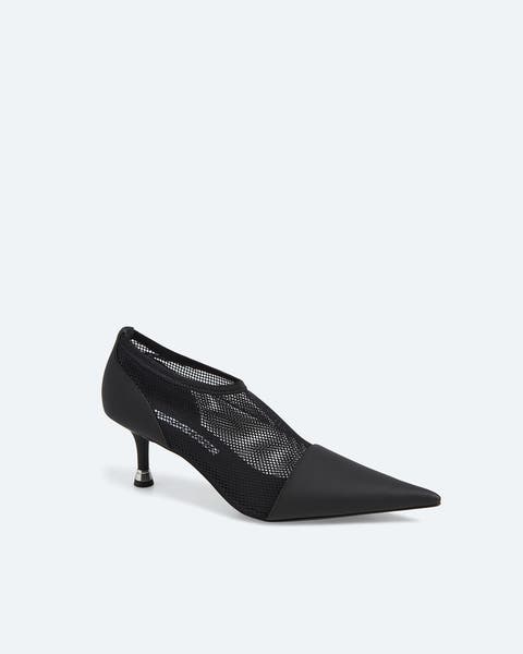 Black pointed-toe kitten heel with a mesh upper and solid heel counter