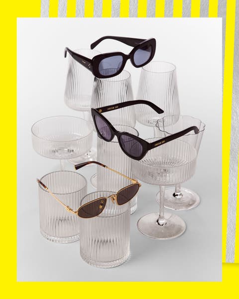 A collection of sunglasses on glassware.