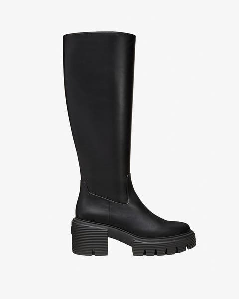 A black knee high boot.