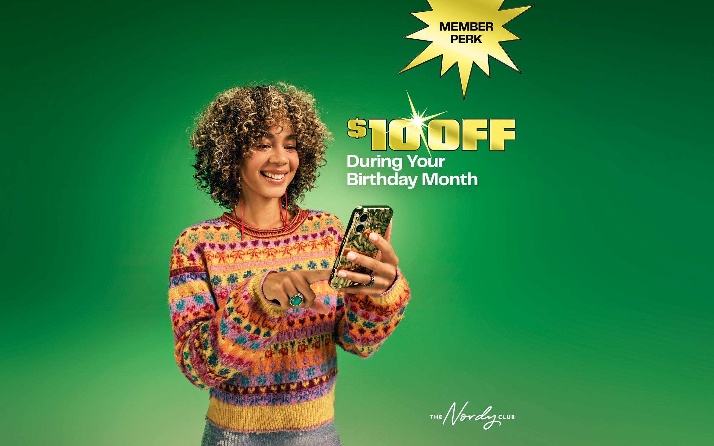 Member perk: annual birthday perk. A woman looking at her phone.