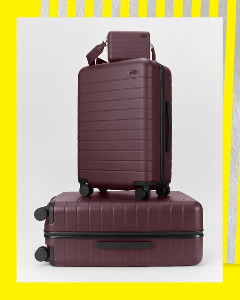 Wheeled suitcases and a matching handbag.