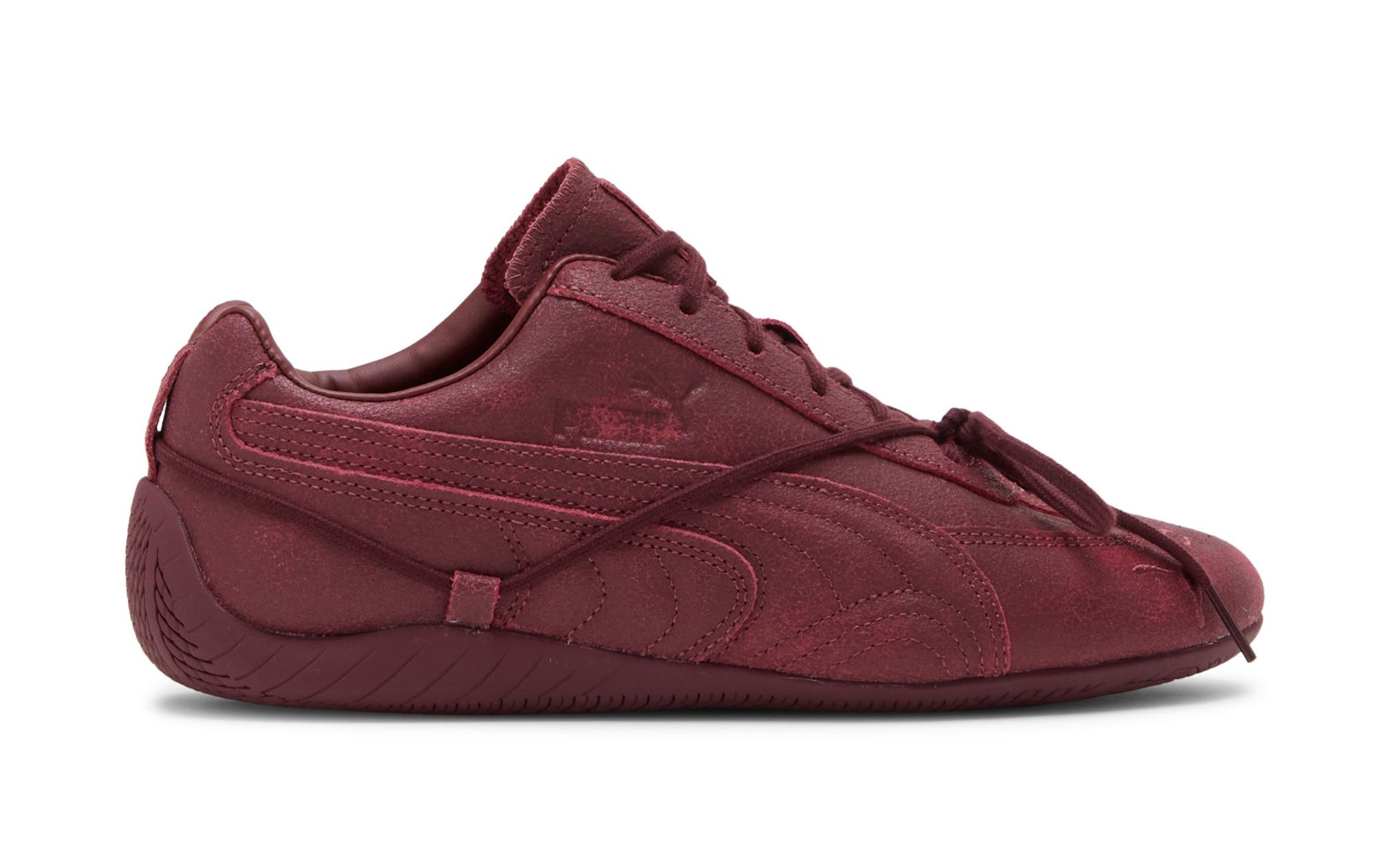Burgundy PUMA sneaker.