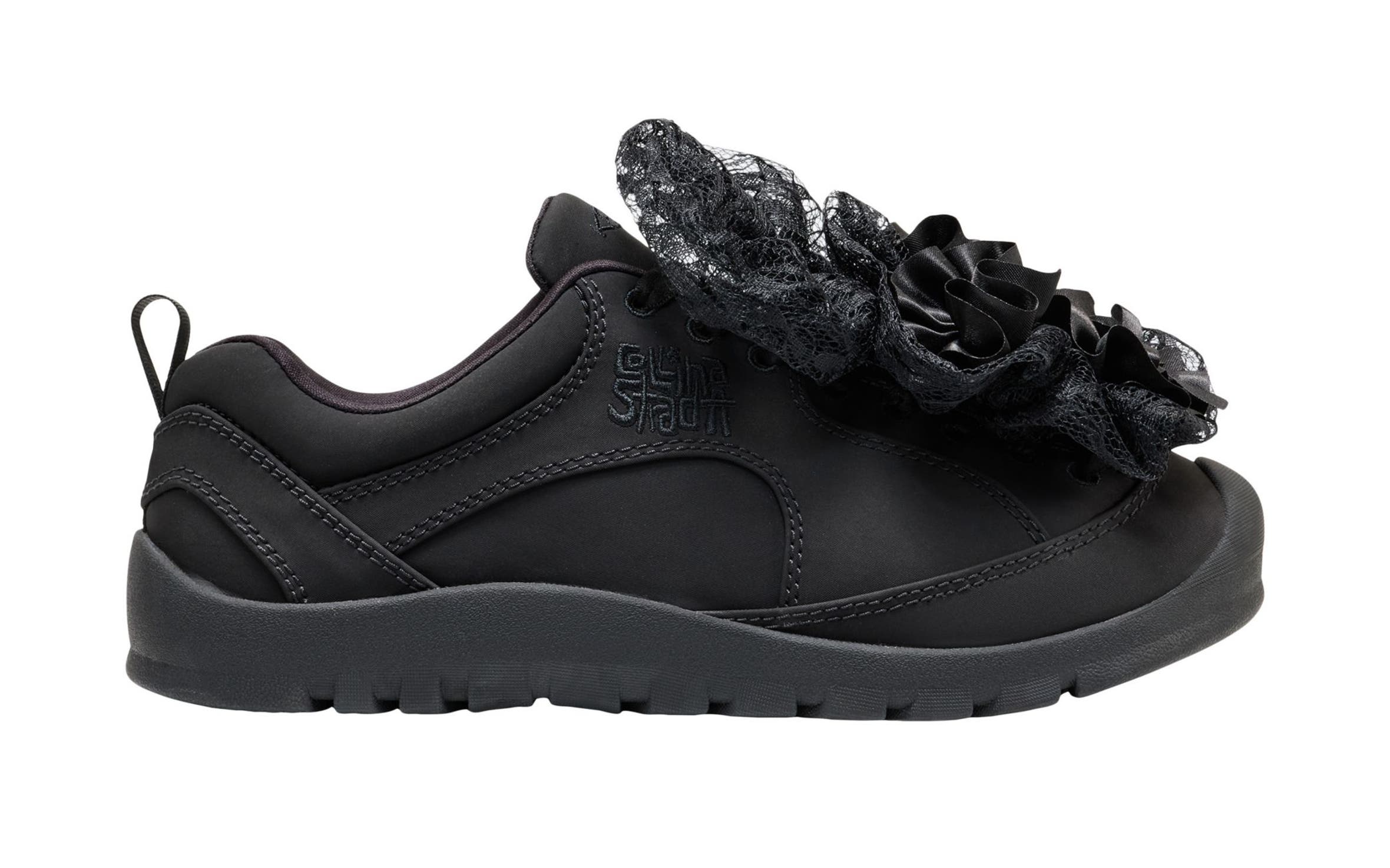 Keen sneaker with large bows.