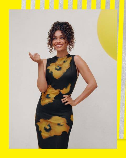 A woman wearing a printed dress.