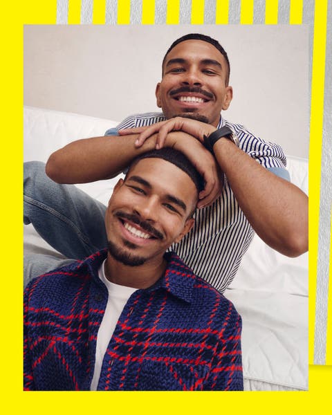 Two men wearing button-up shirts.
